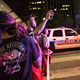 Bystanders stand near police barricades following the sniper shooting in Dallas on July 7, 2016.
LAURA BUCKMAN/AFP/Getty Images